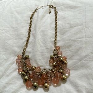 Costume jewelry necklace with pink and gold beads form chunky neckline. So cute.